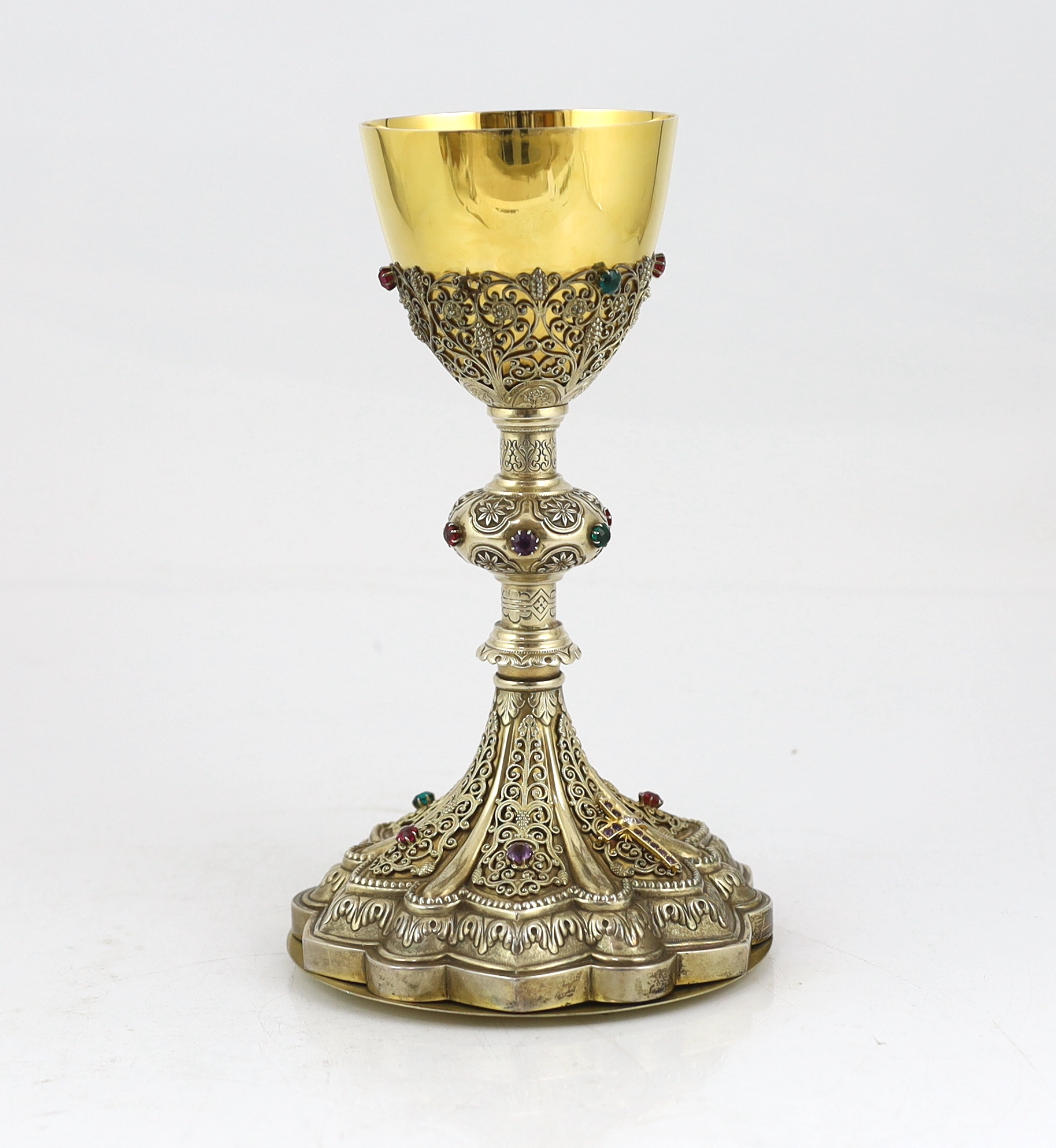 A late 19th/early 20th century American Eucharistic 14kt gold, silver gilt and multi coloured paste set chalice by Benziger Brothers, New York